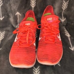 Orange Nike Flyknit Sneakers